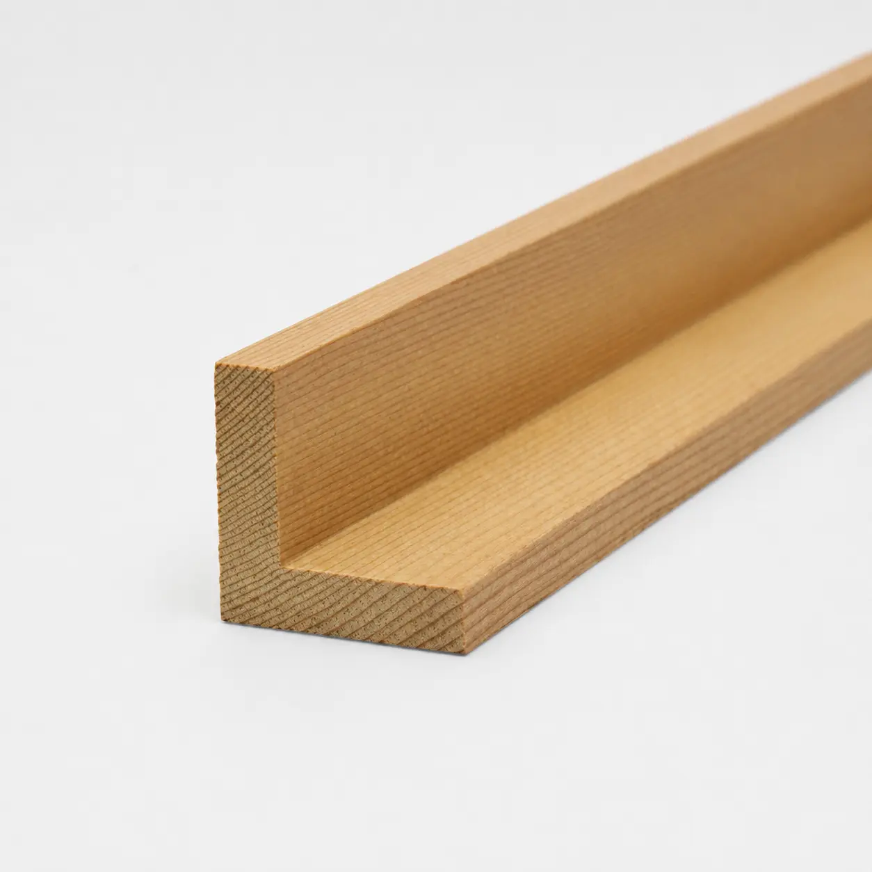 An L-shaped Cedar corner angle trim board displaying fine natural wood grain lines against a clean white background.