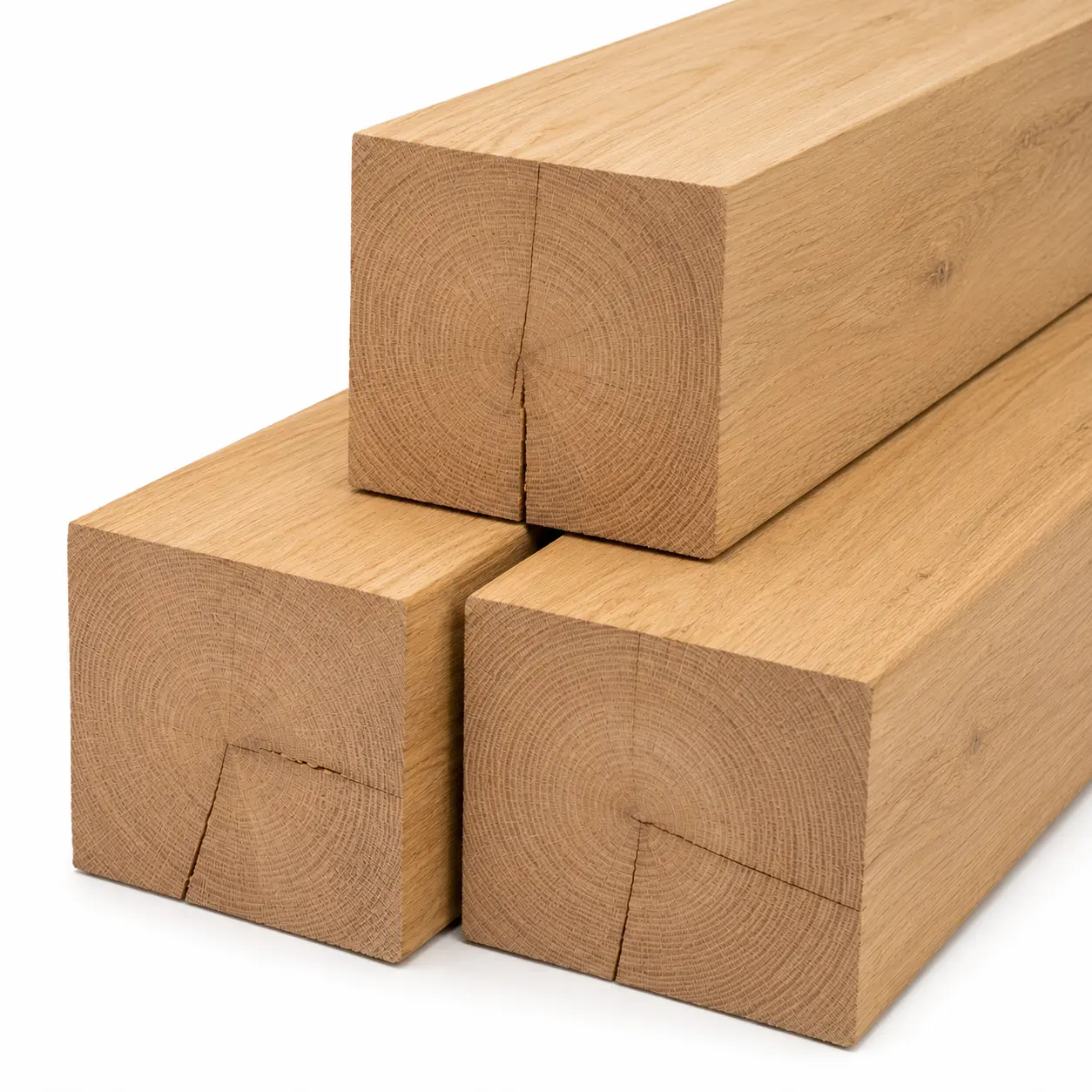 Three large square Oak timber beams stacked against a white background, highlighting end grain.