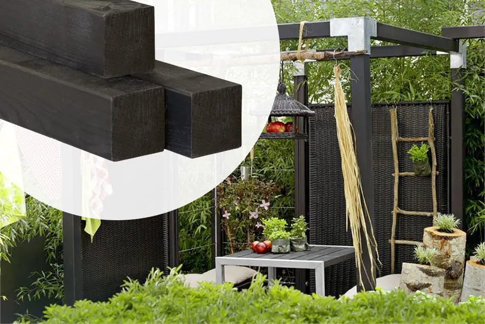 Three black-stained square spruce timber posts highlighting the cross-section ends against an outdoor garden patio pergola application.