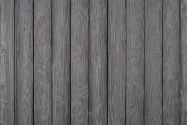 Siberian Larch charred timber cladding board in light grey finish with vertical grain.