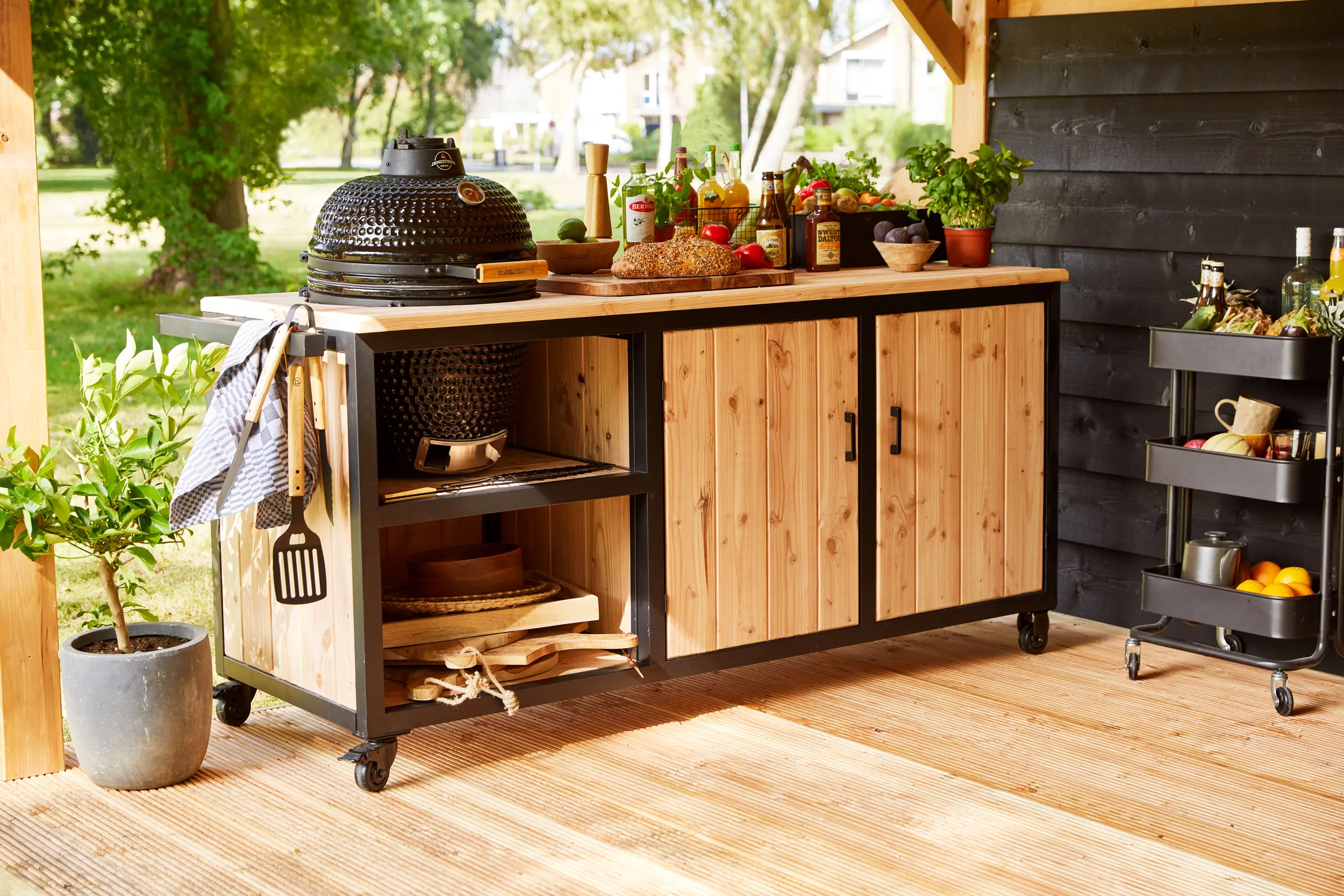 Acero outdoor kitchen station 190cm made of Douglas fir wood with a black grill.