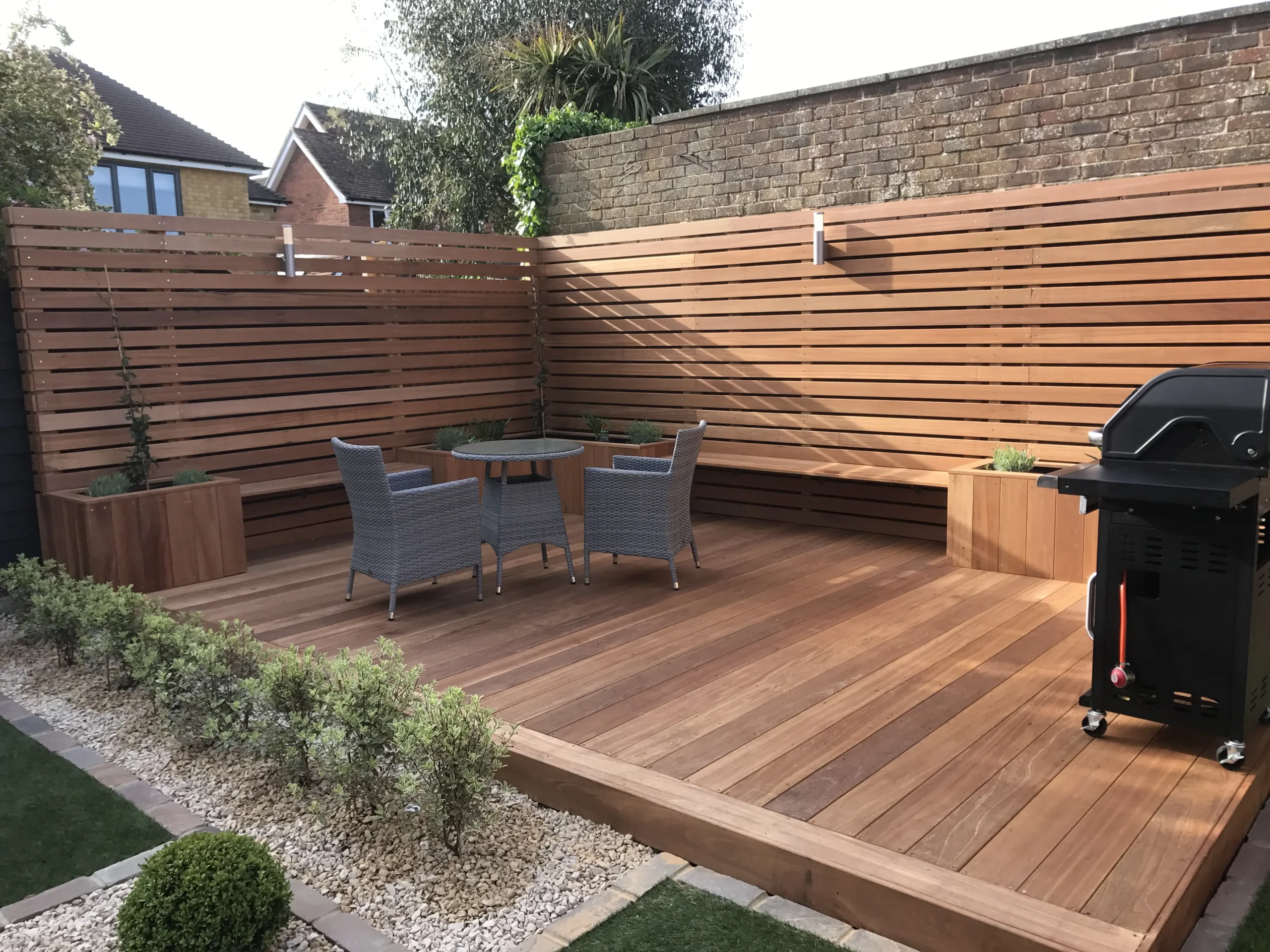 Ecowood cladding board installed on a garden patio deck fence