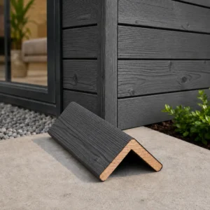 Siberian Larch charred timber cladding corner trim in dark grey finish installed on exterior wall.