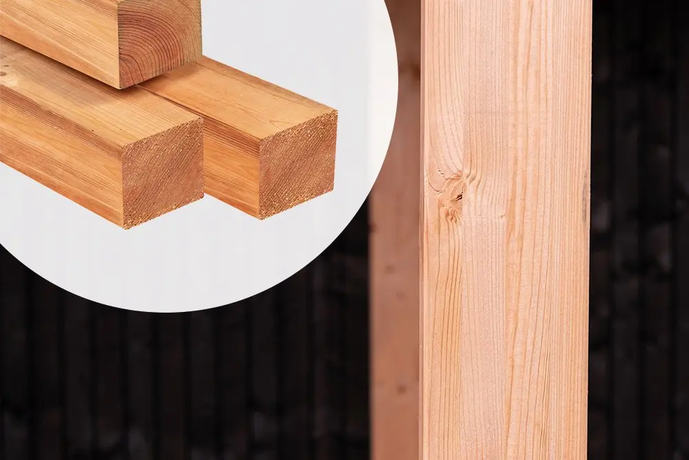 Structural timber framing detail showing a vertical post jointed to a horizontal frame built with an Ecowood Beam measuring 140x140mm with a 6000mm length against a dark cladded wall.