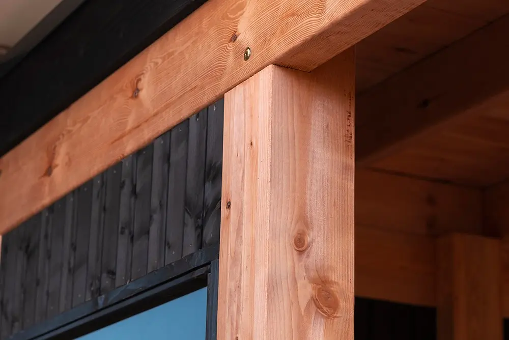 Structural assembly detail highlighting the joint connection between a vertical post and horizontal beam built with an Ecowood Beam measuring 200x200mm with a 5000mm length.