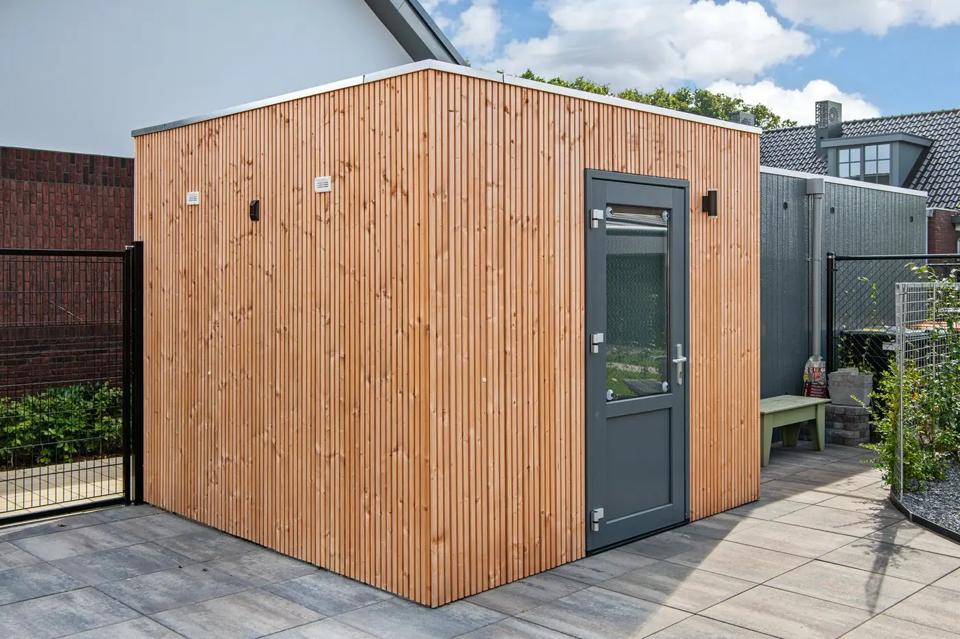 Modern garden studio clad in Ecowood Cladding Board Triple Slatted Profile 4000mm.