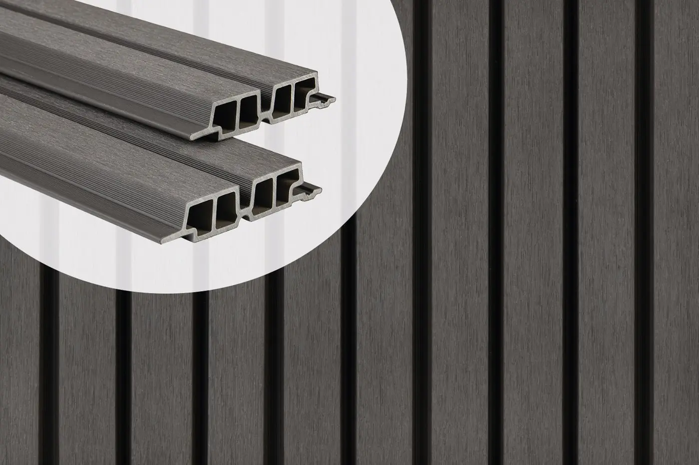PuraTech 55 double profile composite cladding boards in Dark Grey showcasing the hollow cross-section profile against an installed slatted wall panel.