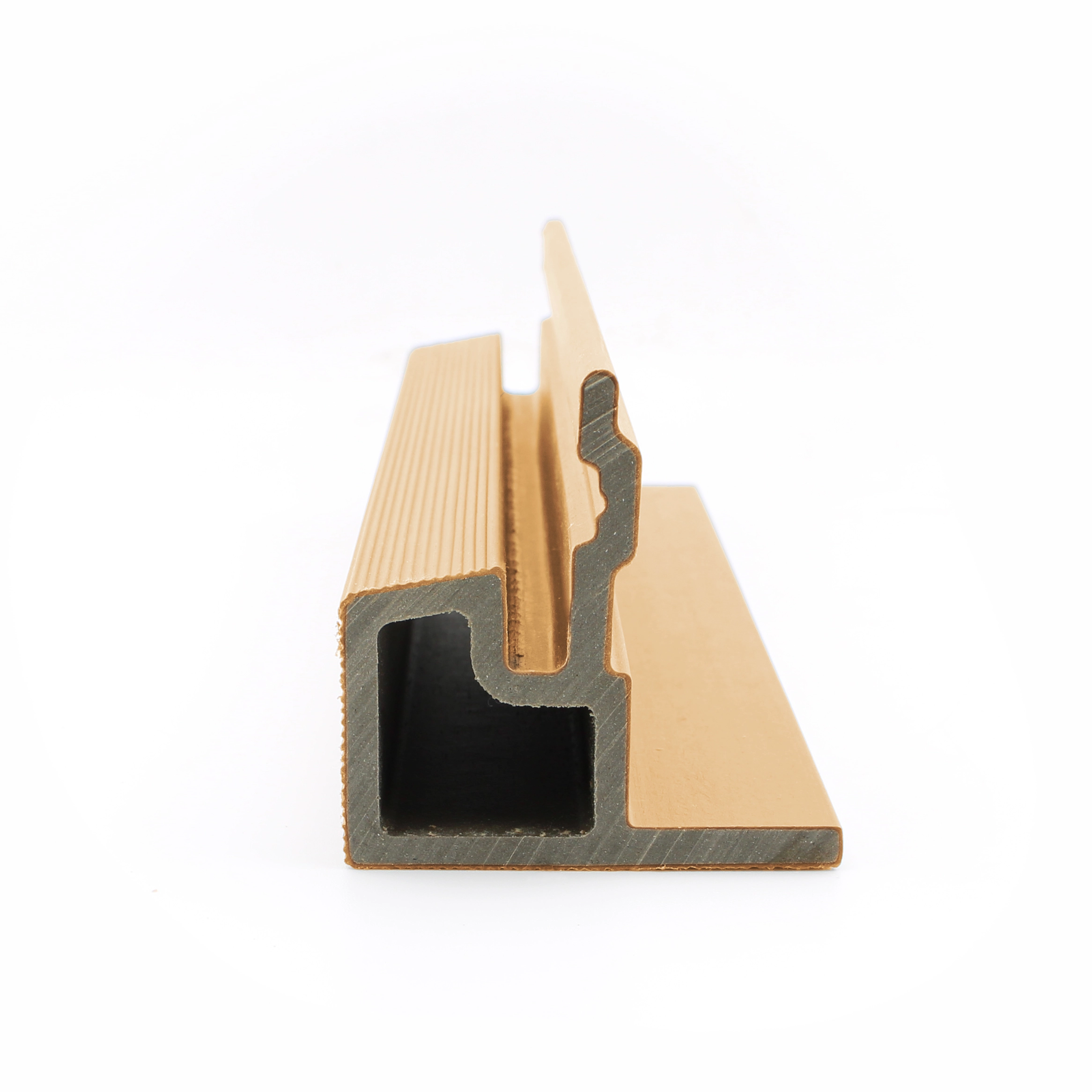 Profile view of a PuraTech composite end trim section piece in a cedar finish showing its interlocking structural profile design against a white background.