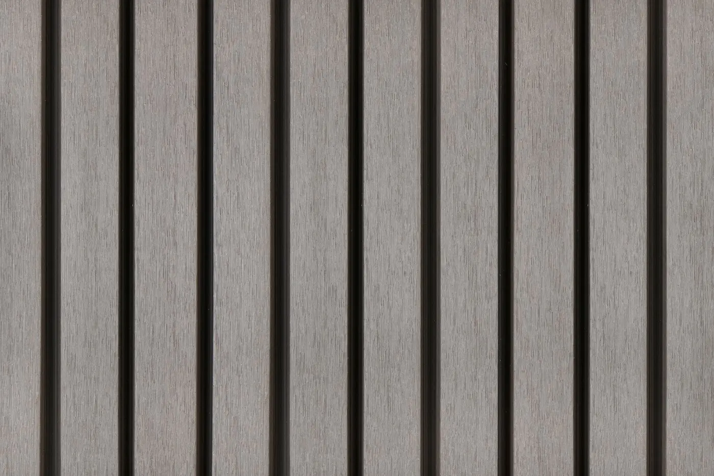 PuraTech 55 double profile composite cladding boards in light grey finish with deep vertical grooves.