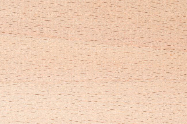 Steamed beech hardwood grain detail square showing even pink-brown colour and fine close texture