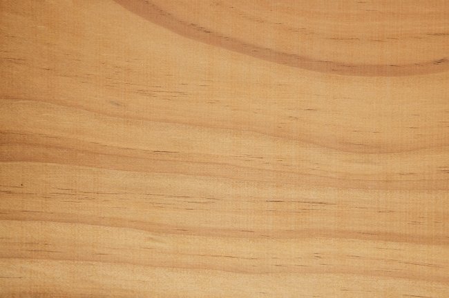ThermoWood radiata pine timber grain detail square showing warm caramel colour from thermal modification and prominent cathedral grain